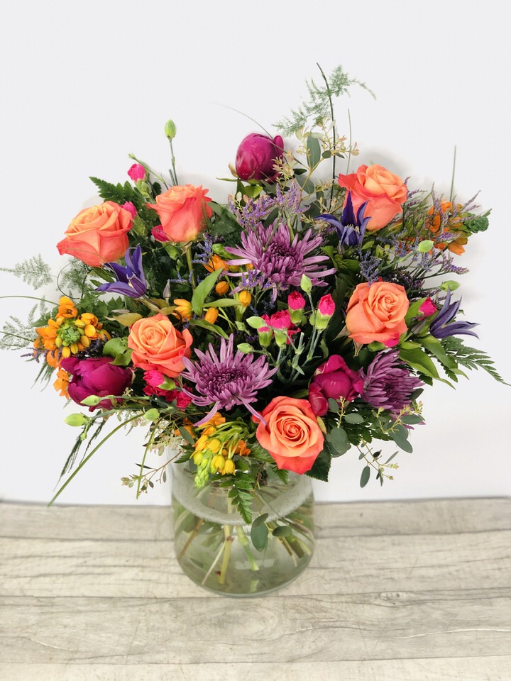 <h2>Summer Large Vase of Flowers - Hand Delivered</h2>
<p>These beautiful fresh flowers hand-arranged by our professional florists into a large eco-glass vase are a delightful choice from our new Summer collection. This vase contains lots of Summer favourites and it would make the perfect gift for any occasion or to let someone know you are thinking of them.</p>
<h2>Flower Delivery Coverage</h2>
<p>Our shop delivers flowers to the following Liverpool postcodes L1 L2 L3 L4 L5 L6 L7 L8 L11 L12 L13 L14 L15 L16 L17 L18 L19 L24 L25 L26 L27 L36 L70 If your order is for an area outside of these we can organise delivery for you through our network of florists. We will ask them to make as close as possible to the image but because of the difference in stock and sundry items, it may not be exact.</p>
<h2>Vase of Flowers | Flowers in a Vase</h2>
<p></p>
<p>The advantage of having an arrangement made this way is that they are artfully arranged by our florists into the vase so that they stay in the display.</p>
<p>Being delivered in a vase and in water means the recipient does not need to arrange the flowers themselves, they can just put them down and enjoy.</p>
<p>Featuring 6 Orange Roses, 3 Purple Blooms, 3 Blue Clematis, 2 Purple Limo, 4 Orange Chinneys, 4 Cerise spray Cars, 3 Cerise Peonies, mixed foliage's including Asparagus fern, bear grass, Eucalyptus and leather.</p>
<h2>Eco-Friendly Liverpool Florists</h2>
<p>As florists we feel very close earth and want to protect it. Plastic waste is a huge problem in the florist industry so we made the decision to make our packaging eco-friendly.</p>
<p>To achieve this, we worked with our packaging supplier to remove the lamination off our boxes and wrap the tops in an Eco Flowerwrap, which means it easily compostable or can be fully recycled.</p>
<p>Once you've finished enjoying your flowers from us, they will go back into growing more flowers! Only a small amount of plastic is used as a water bubble and this is biodegradable.</p>
<p>Even the sachet of flower food included with your bouquet is compostable.</p>
<p>All our bouquets have small wooden ladybird hidden amongst them, so do not forget to spot the ladybird and post a picture on our social media pages to enter our rolling competition.</p>
<h2>Flowers Guaranteed for 7 Days</h2>
<p>Our 7-day freshness guarantee should give you confidence that we will only send out good quality flowers.</p>
<p>Leave it in our hands we will create a marvellous bouquet which will not only look good on arrival but will continue to delight as the flowers bloom.</p>
<h2>Liverpool Flower Delivery</h2>
<p>We are open 7 days a week and offer advanced booking flower delivery, same-day flower delivery, 3-hour flower delivery. Guaranteed AM PM or Evening Flower Delivery and also offer Sunday Flower Delivery.</p>
<p>Our florists deliver in Liverpool and can provide flowers for you in Liverpool, Merseyside. And through our network of florists can organise flower deliveries for you nationwide.</p>
<h2>The Best Florist in Liverpool, your local Liverpool Flower Shop</h2>
<p>Come to Booker Flowers and Gifts Liverpool for your beautiful flowers and plants. For that bit of extra luxury, we also offer a lovely range of finishing touches, such as wines, champagne, locally crafted Gin and Rum, vases, Scented Candles and Chocolates that can be delivered with your flowers.</p>
<p>To see the full range, see our extras section.</p>
<p>You can trust Booker Flowers and Gifts of delivery the very best for you.</p>
<p><em>5 Star review on Yell.com</em></p>
<p><em>Thank you Gemma for your fabulous service. The flowers are of the highest quality and delivered with a warm smile. My sister was delighted. Ordering was simple and the communications were top-notch. I will definitely use your services again.</em></p>